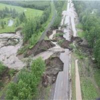 road washed away by water released from a dam