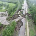 road washed away by water released from a dam